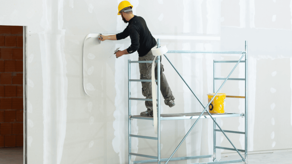 guy plastering a wall